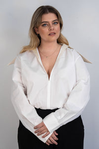 Body Mugler blanc en jersey stretch avec col pointé satiné contrastant, fermeture éclair arrière, coupe sculptante ajustée, design architectural Casey Cadwallader_Vue de face