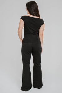 Jumpsuit Chiara Boni La Petite Robe Rebecca en lurex noir métallique avec encolure épaules dénudées et découpes stratégiques vue de dos