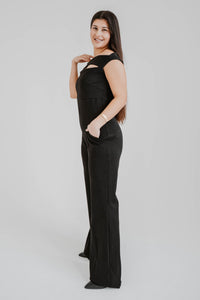 Jumpsuit Chiara Boni La Petite Robe Rebecca en lurex noir métallique avec encolure épaules dénudées et découpes stratégiques vue latérale